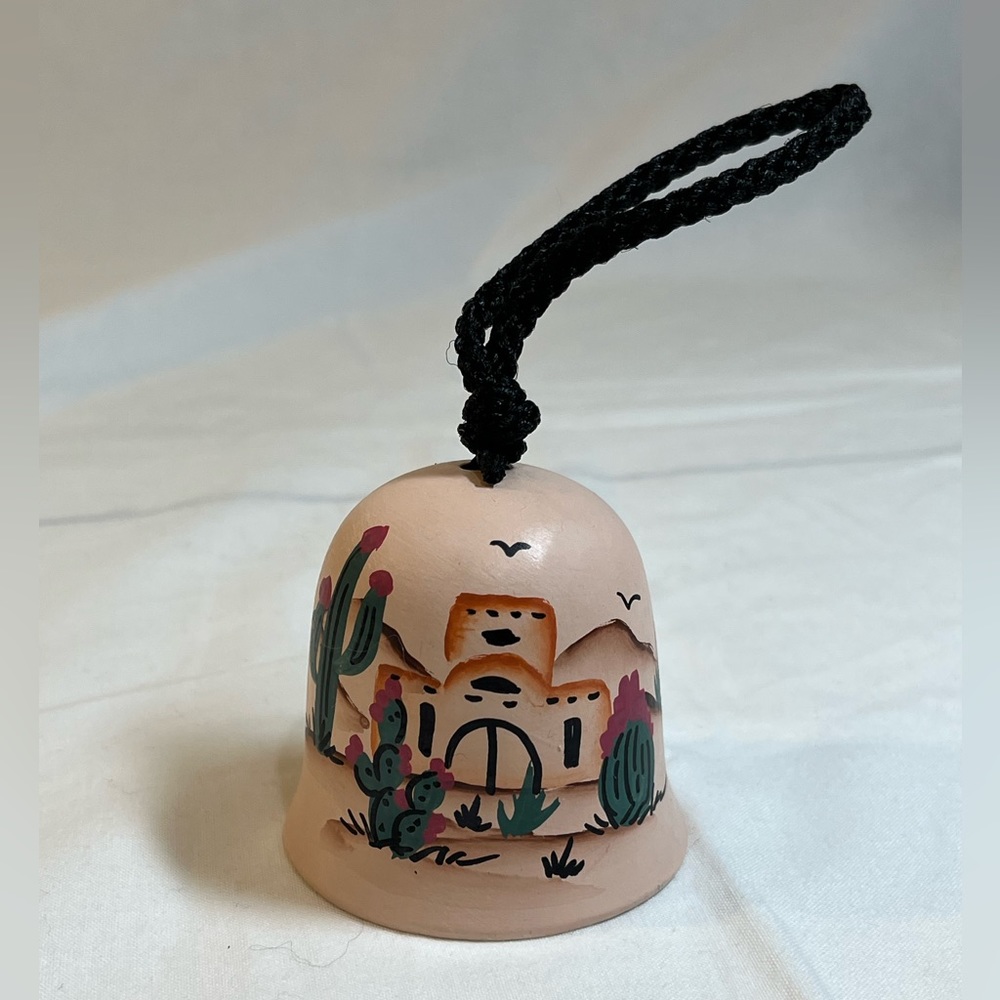 Vintage Southwestern Desert theme. Ceramic 2 inch bell beautifully painted.